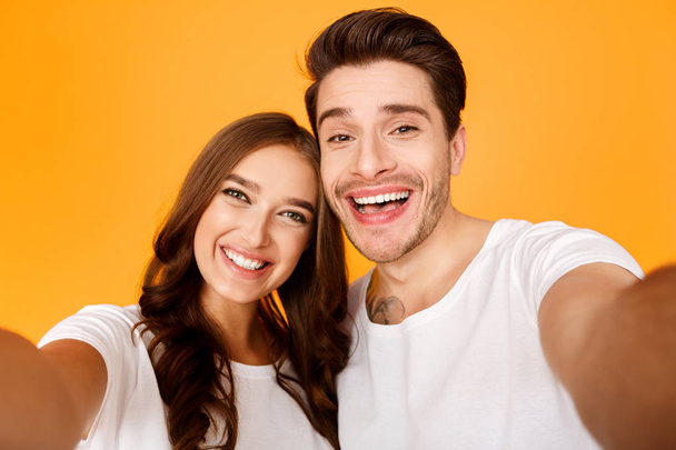 Capturing happy moments. Happy loving couple making selfie - Photo, Image
