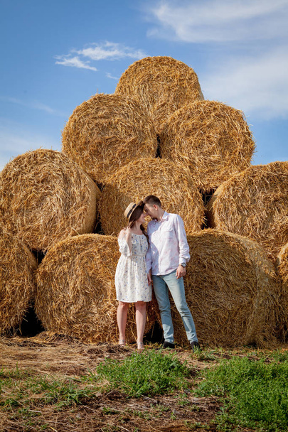 Happy young couple on straw, romantic people concept, beautiful  - Фото, зображення