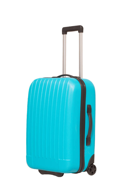 Blue travel suitcase isolated on white background. - 写真・画像