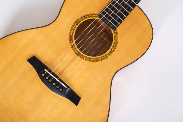 wood texture of lower deck of six strings acoustic guitar on whi - Fotó, kép