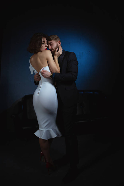 man in a fit of passion flattens a gorgeous woman's dress - Foto, immagini