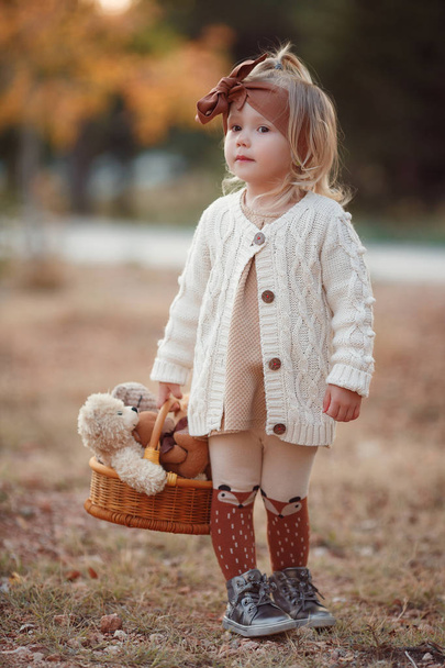 Little fashionista. Happy girl on autumn day. Little girl happy smiling with autumn leaves. Girls autumn style. Stylish by nature.Little girl excited about autumn season. Autumn warm season pleasant moments. Kid girl smiling face hold maple leaves. - Photo, Image