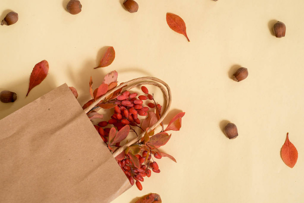Craft envelope, leaves, pumpkins on vintage wooden background. Flat lay, top view, overhead. Cozy home workspace,Cozy concept.Thanksgiving autumn start flatlay, - Photo, Image