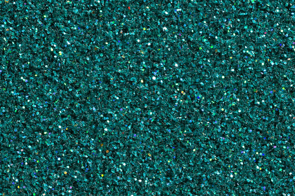 Donkere Turquoise glanzende achtergrond met glitter close-up. - Foto, afbeelding