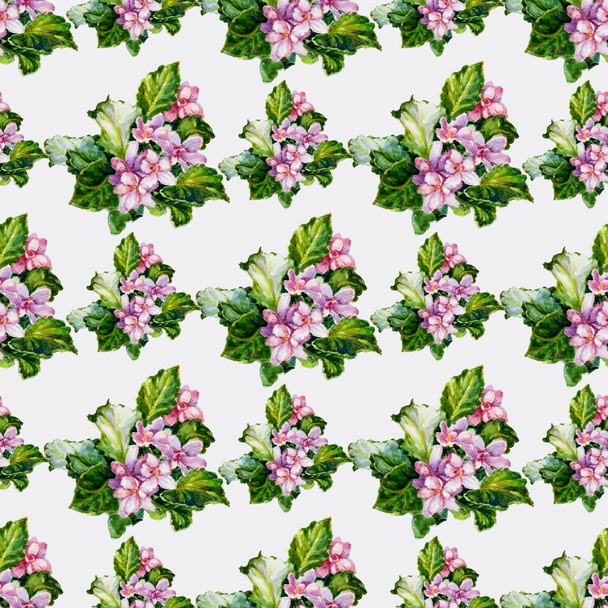 Seamless decorative pattern of watercolor viola flowers and green leaves. - Foto, afbeelding