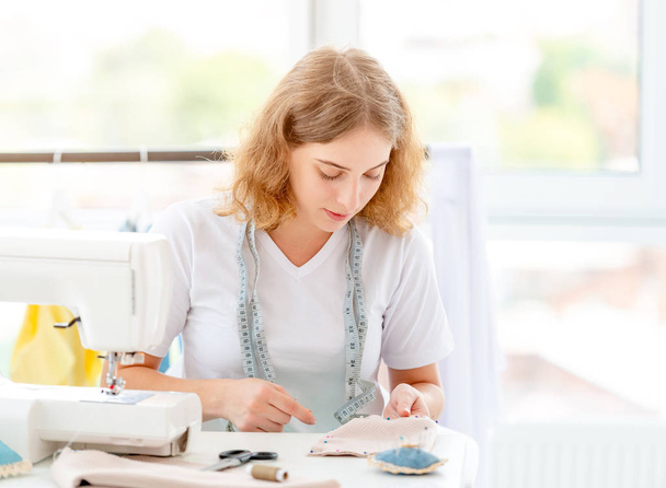 Dressmaker sewing new design by hands - Zdjęcie, obraz