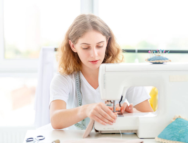Dressmaker sewing new design by hands - Фото, изображение