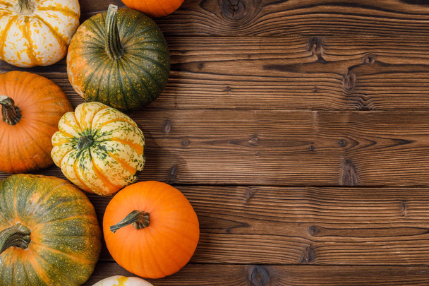 Pumpkins on wooden background - Photo, Image