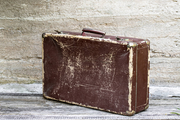 Old suitcase on wooden background  - Φωτογραφία, εικόνα