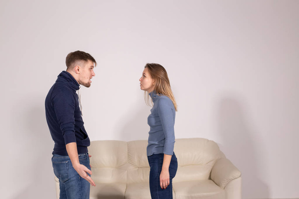 people, home violence and abuse concept - young couple screaming to each other - Photo, Image