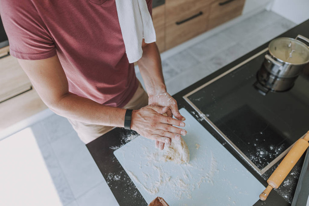 Cook finishing working with dough before baking - Foto, Bild