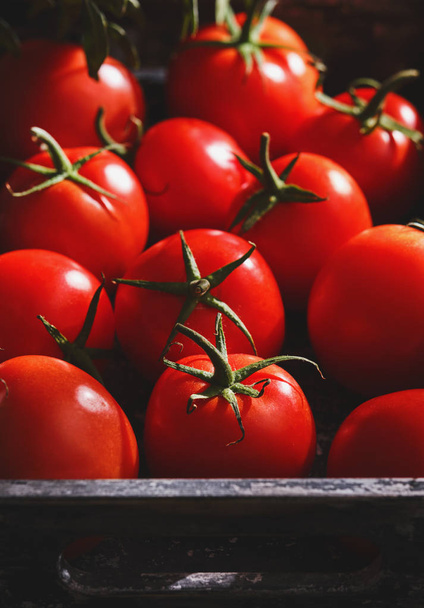 Fresh ripe red tomatoes in a crate - Fotó, kép