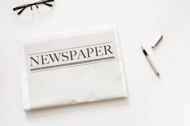 Newspaper and coffee on white background - Photo, Image