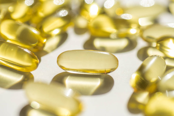 capsules of fish fat oil vitamin for heart, omega 3, macro - Foto, afbeelding