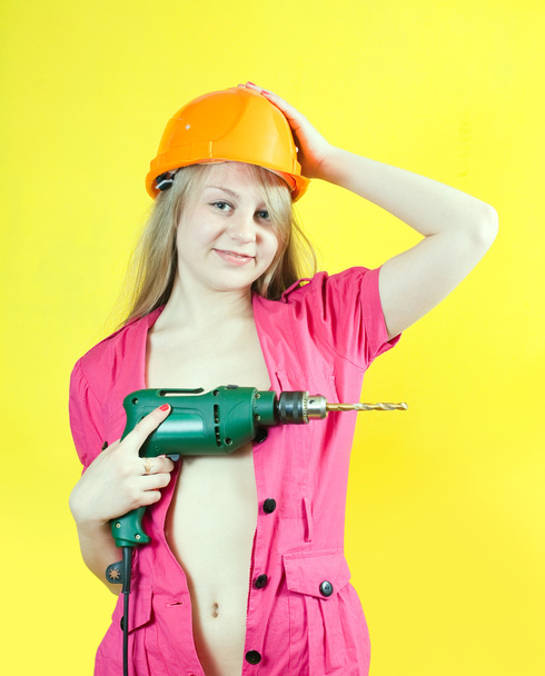Sexy girl with drill - Foto, imagen