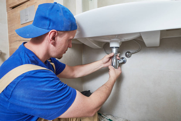 plumber service. wash basin siphon installation - Photo, image