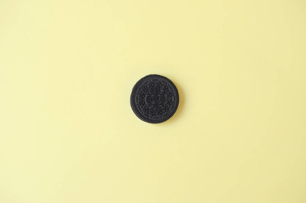 One OREO sandwich cream biscuits on yellow background - Foto, Imagem