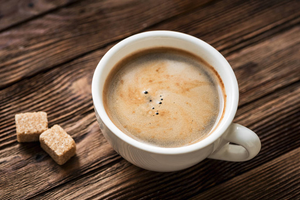 Xícara de café expresso e açúcar mascavo
 - Foto, Imagem