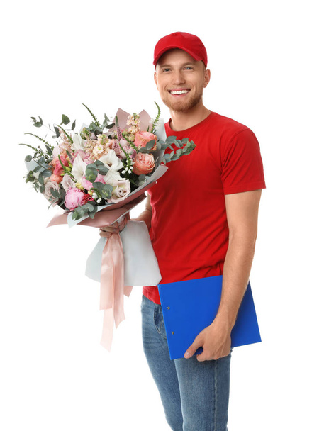 Delivery man with beautiful flower bouquet isolated on white - Фото, изображение