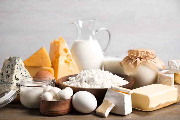 Different delicious dairy products on wooden table - Photo, Image