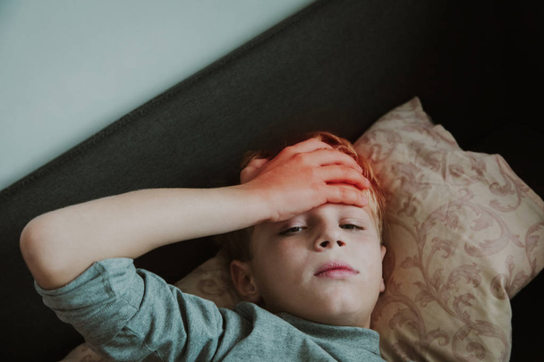 Sick child with headache, pain concept, virus or infection, kid with fever - Fotografie, Obrázek
