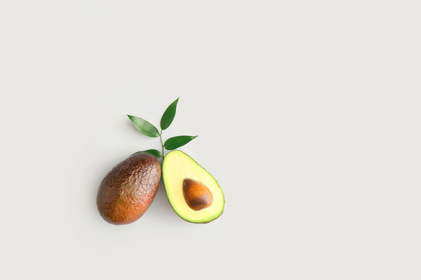 Fresh ripe avocados on white background - 写真・画像