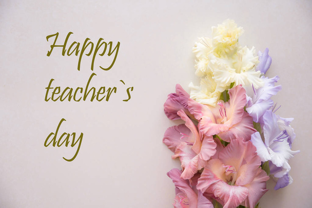 Happy teacher`s day. Happy teachers day. Greetings card for teacher's day. Postcard with colorful gladiolus - Photo, Image
