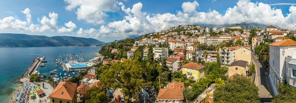 Seaside city of Herceg Novi in Montenegro on a green hill near the bay - Photo, Image