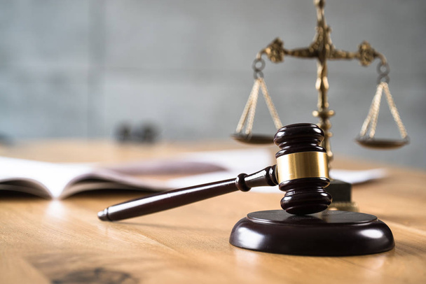 Law and Justice, judge gavel on wooden table with blurred background. - Foto, afbeelding