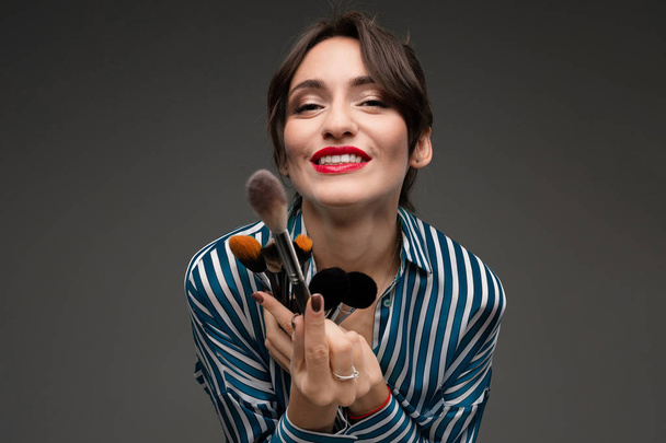 young beautiful woman with make up brushes - Foto, Bild