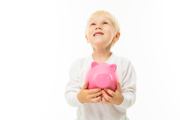 little boy with piggy bank  - Foto, Bild