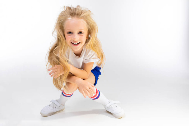 cute little blond girl posing in studio  - Photo, Image