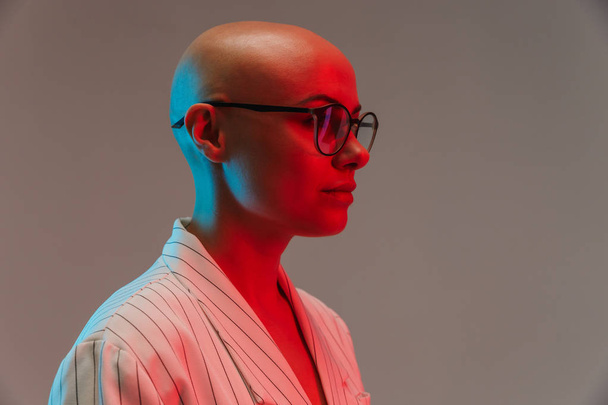 Portrait of an attractive bald woman wearing jacket - 写真・画像