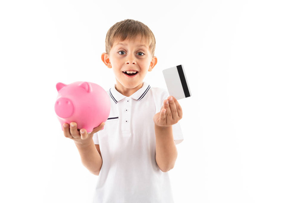 boy with piggy bank and credit card  - Photo, Image