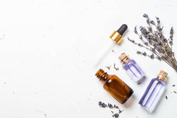 Lavender essential oil on white. - Фото, изображение