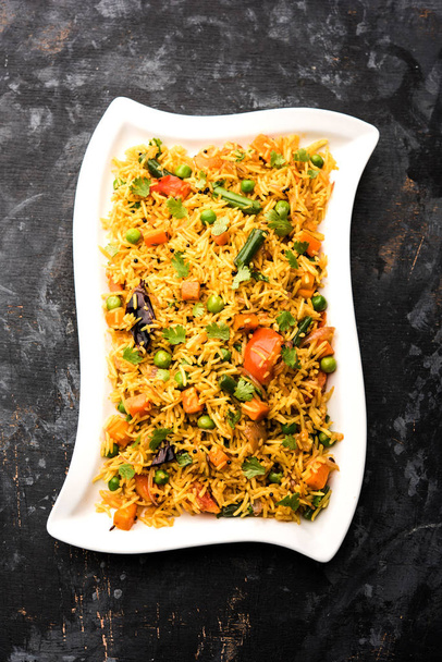 Tawa Pulao / Pulav / Pilaf / Pilau is an Indian Street Food made using basmati rice, vegetables and spices. Селективный фокус
 - Фото, изображение