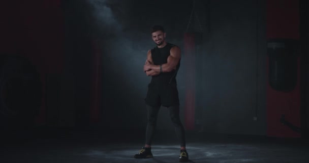 Smiling large athletic guy posing in front of the camera in a cross fitness class he showing big like and feeling happy - Video, Çekim