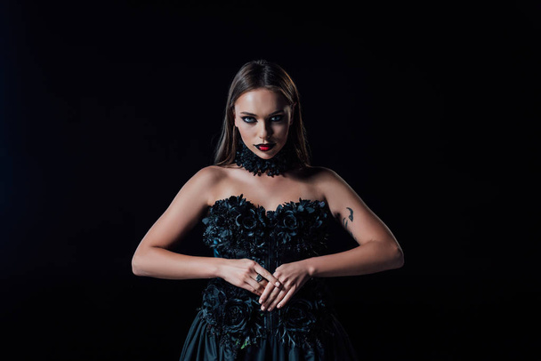 scary vampire girl in black gothic dress isolated on black - Photo, Image