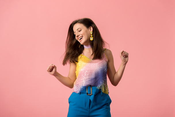 excited young stylish disco girl dancing isolated on pink - Foto, Imagem