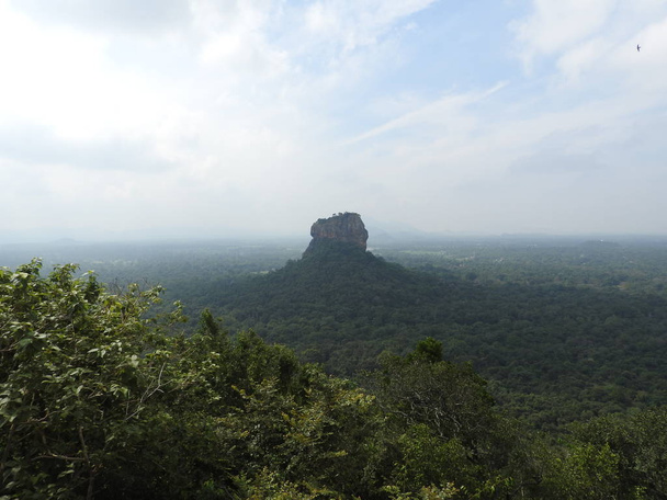 The historical Sigiriya rock fortress is surrounded by a breathtaking landscape - Zdjęcie, obraz