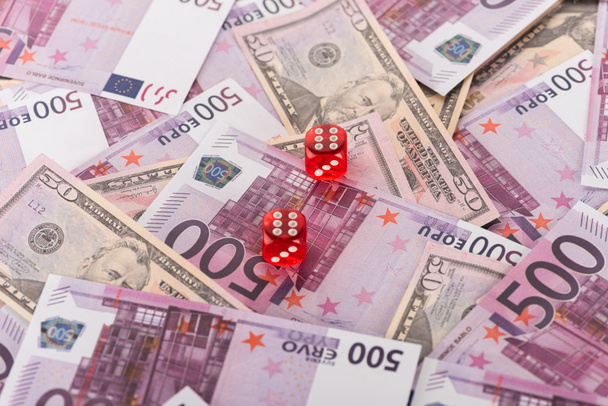 dice on euro and dollar banknotes, sports betting concept - Fotografie, Obrázek