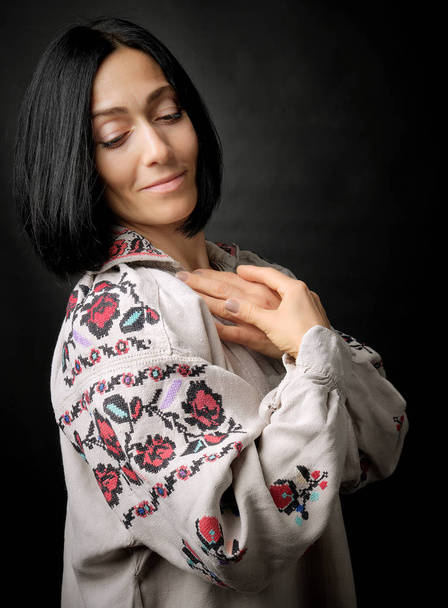 beautiful young woman in an embroidered ancient Ukrainian dress  - Fotografie, Obrázek