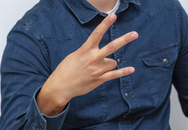 símbolo, gesto do dedo que significa rock and roll
 - Foto, Imagem