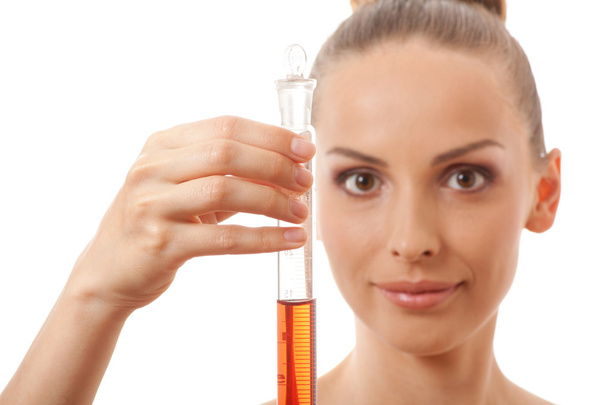 Woman holding test tube with red liquid - Foto, Imagem