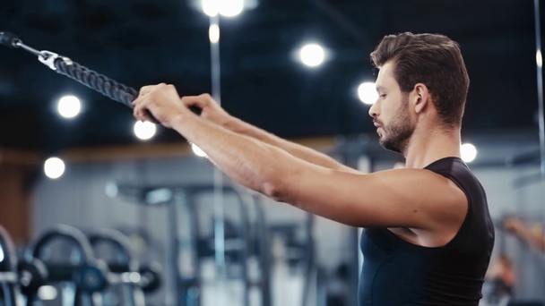 handsome bearded sportsman exercising in gym  - Footage, Video