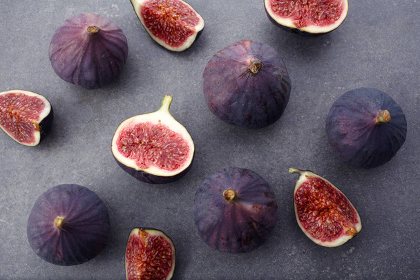 Ripe sweet figs on dark background . Healthy mediterranean fig fruit . Top view - 写真・画像