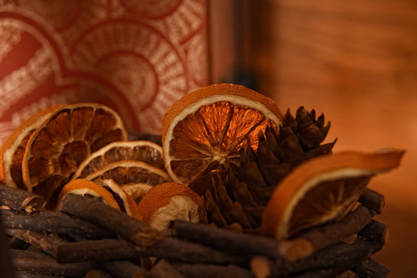 Cozy winter decorative composition with dried oranges and pine cones. Christmas and hand made concept. - Photo, Image