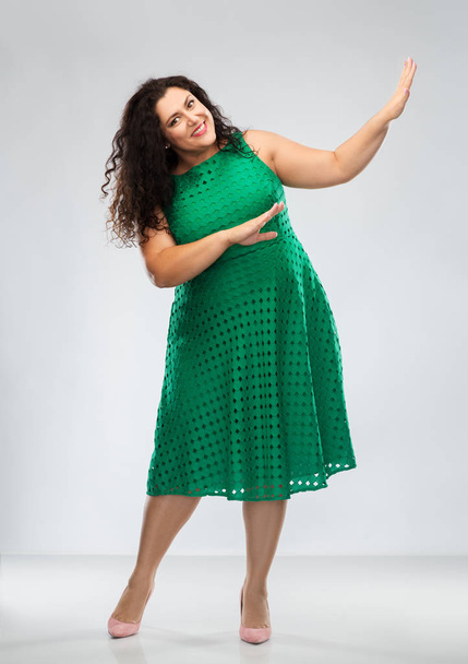 happy woman in green dress over posing - Fotó, kép