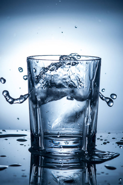 splashing clean water in a glass - Foto, Imagem