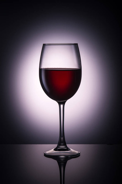 glass of red wine on the background - Foto, imagen